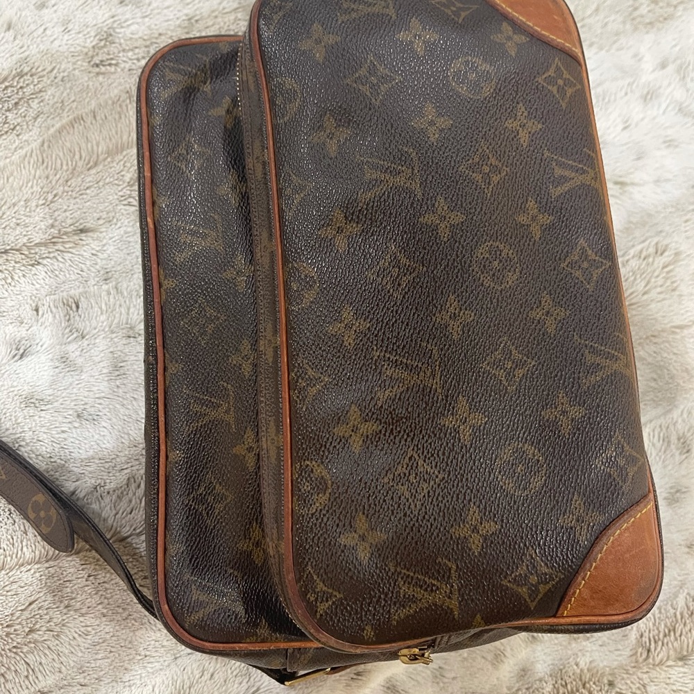 Louis Vuitton shoulder strap messenger bag.